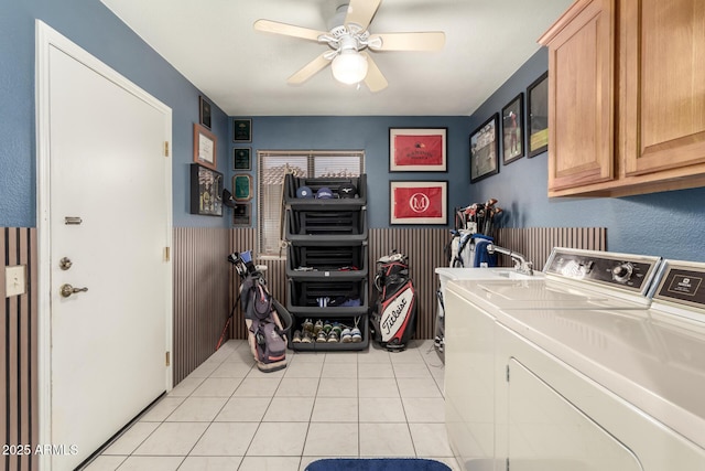 laundry room with cabinets, separate washer and dryer, light tile patterned floors, and ceiling fan