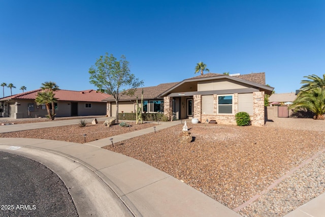 ranch-style home featuring a garage