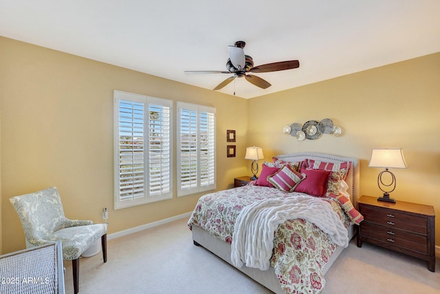 bedroom with light carpet and ceiling fan