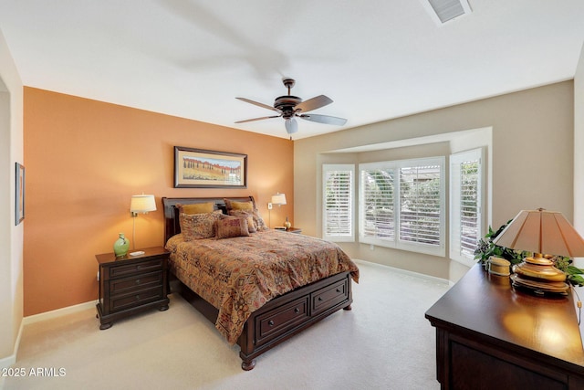 bedroom featuring ceiling fan and light carpet