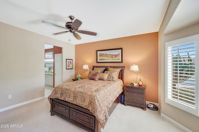 carpeted bedroom featuring ceiling fan and connected bathroom