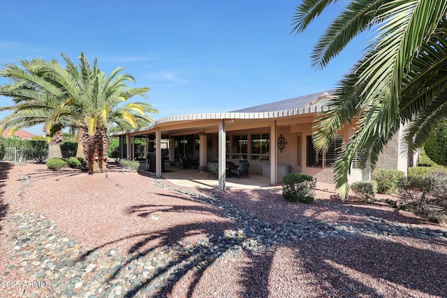 back of property featuring a patio area