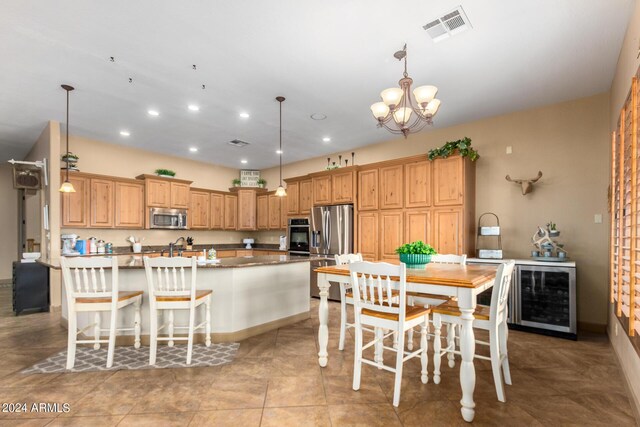 dining area with light tile patterned floors and a chandelier