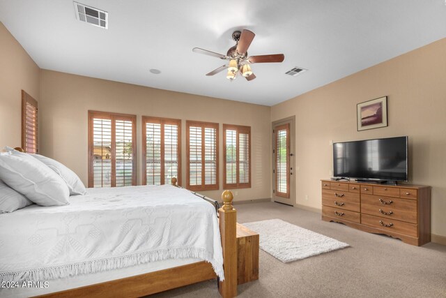 bedroom featuring ceiling fan, light colored carpet, and access to outside