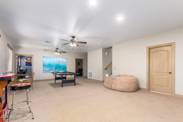 living room featuring ceiling fan and carpet floors