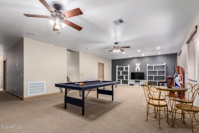 carpeted living room with ceiling fan