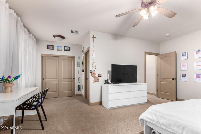 playroom featuring ceiling fan, carpet floors, and a textured ceiling