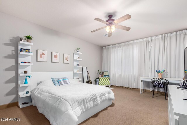 carpeted bedroom with ceiling fan