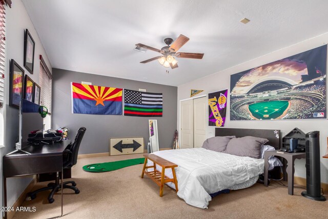 spare room featuring light carpet and ceiling fan