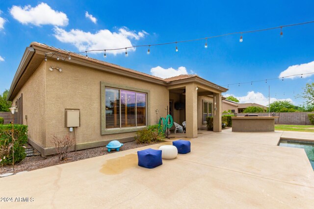 view of pool featuring an outdoor fire pit and a patio area