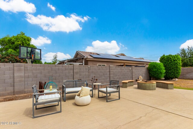 view of patio / terrace featuring an outdoor fire pit