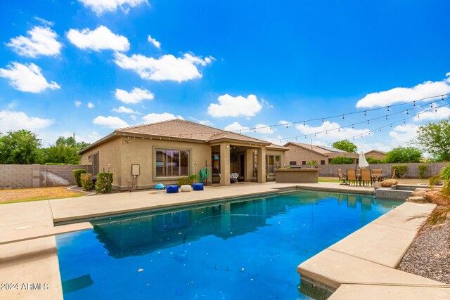 view of pool featuring a diving board and a patio area