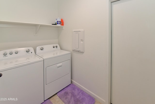 clothes washing area featuring independent washer and dryer