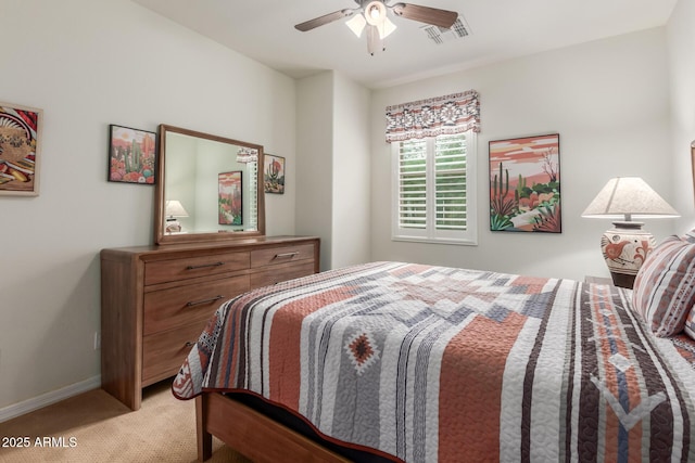 bedroom featuring light carpet, baseboards, and ceiling fan