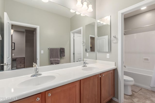 bathroom featuring double vanity, toilet, and shower / bath combination