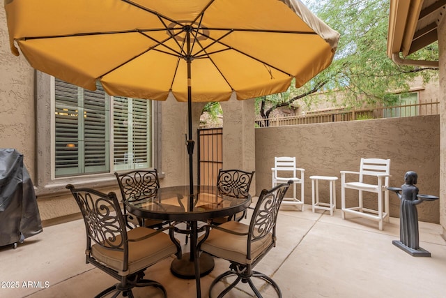 view of patio / terrace featuring outdoor dining space and fence