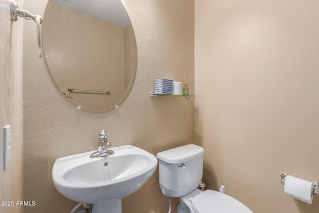 bathroom with a sink and toilet