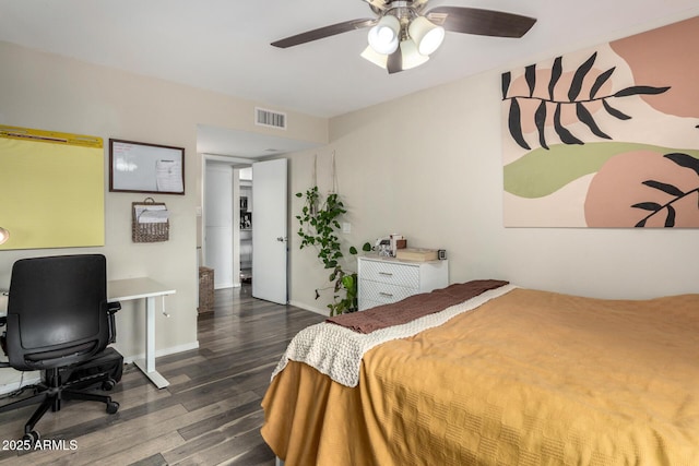 bedroom featuring baseboards, wood finished floors, visible vents, and a ceiling fan