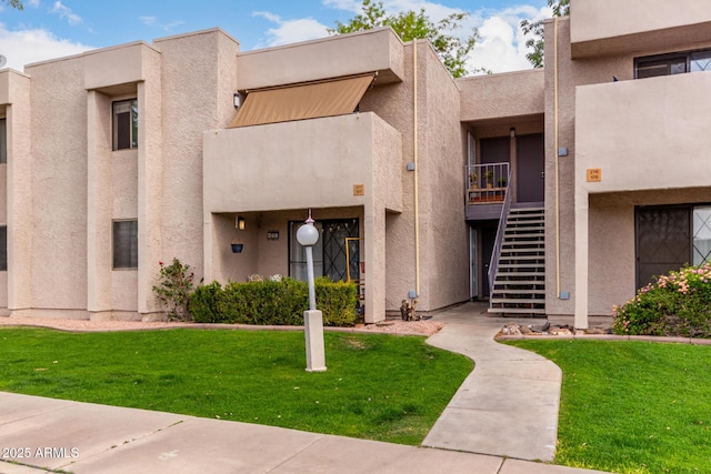 view of property featuring stairs