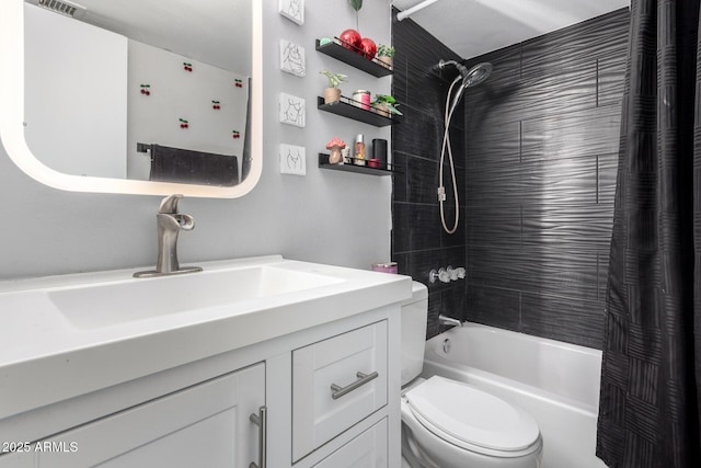 full bath with shower / bath combo, vanity, and toilet