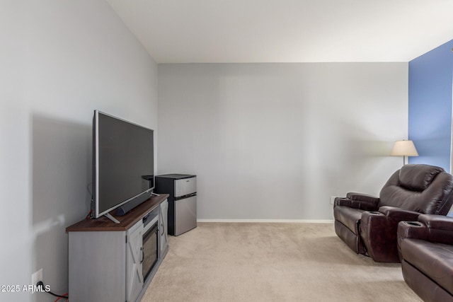 living room with light carpet and baseboards