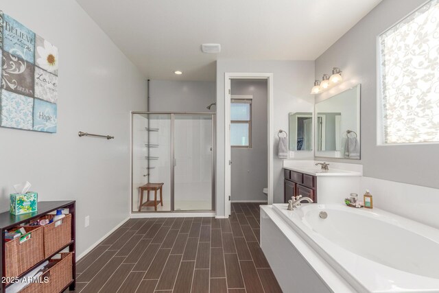 full bathroom featuring a shower stall, toilet, baseboards, a bath, and recessed lighting