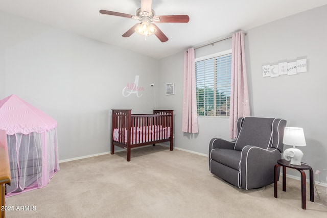 carpeted bedroom with baseboards and ceiling fan