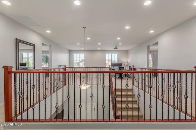 corridor featuring recessed lighting and baseboards