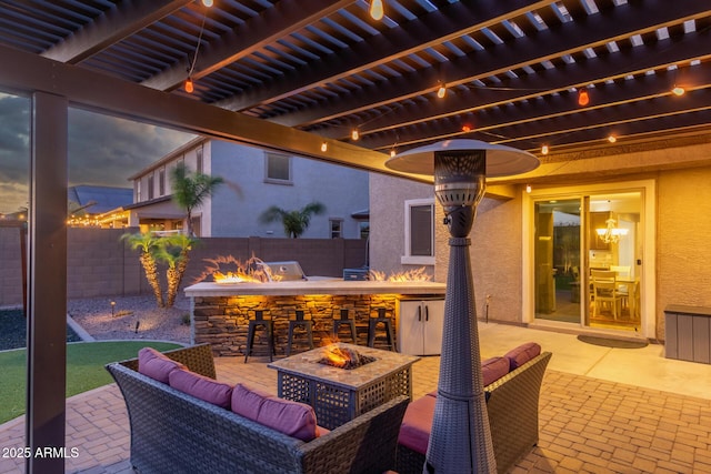 view of patio featuring a fire pit and a fenced backyard