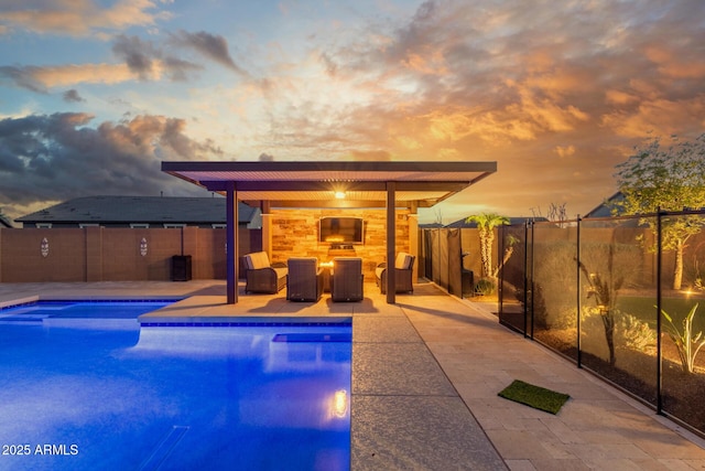view of swimming pool with a patio and a fenced backyard