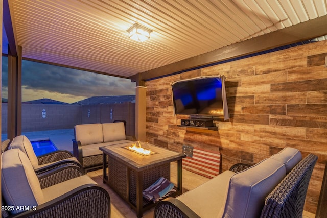 view of patio featuring an outdoor living space with a fire pit