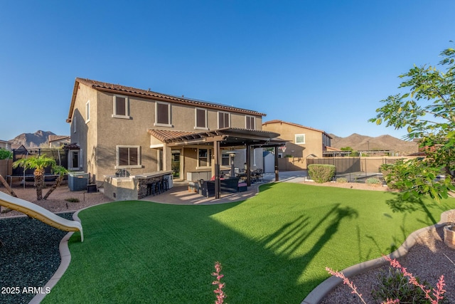 back of house featuring a pergola, cooling unit, area for grilling, a patio area, and stucco siding