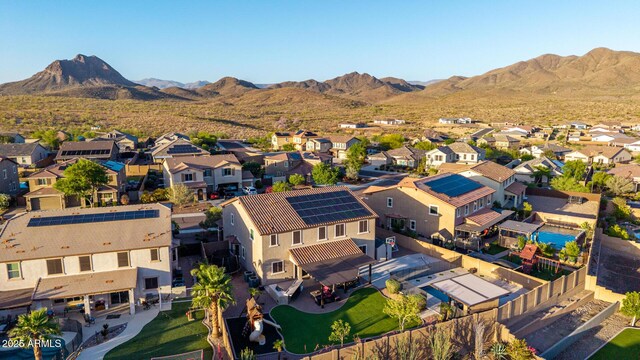 aerial perspective of suburban area with a mountain backdrop