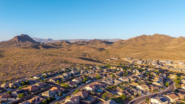 view of property location featuring nearby suburban area and mountains