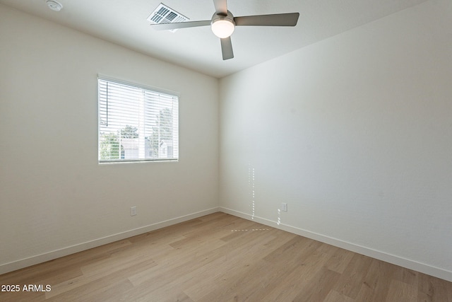 empty room with light wood finished floors, baseboards, and ceiling fan