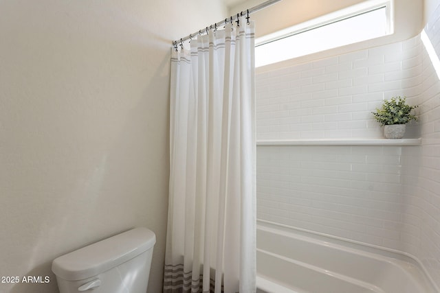 full bath with plenty of natural light, shower / bath combination with curtain, and toilet