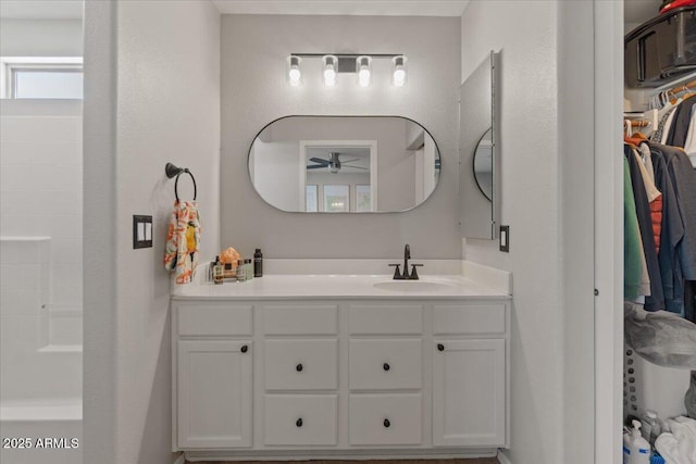 1703 E Palo Blanco Way, Gilbert, AZ 85296 - bathroom with a ceiling fan, vanity, and a walk in closet