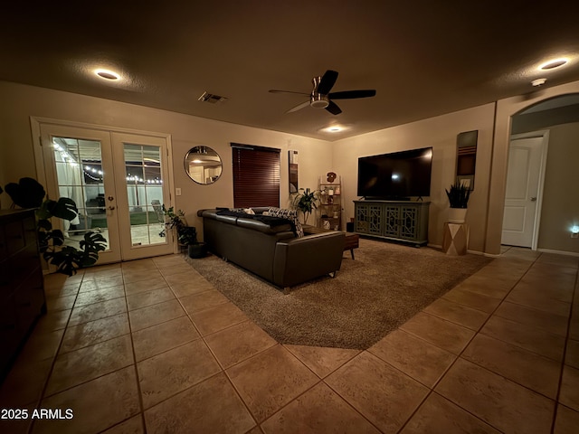 1703 E Palo Blanco Way, Gilbert, AZ 85296 - tiled living area with french doors, a ceiling fan, and arched walkways
