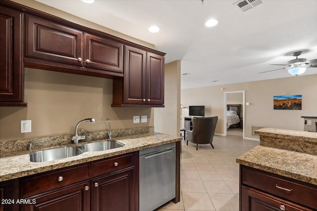 kitchen with light stone countertops, sink, ceiling fan, stainless steel dishwasher, and light tile patterned floors