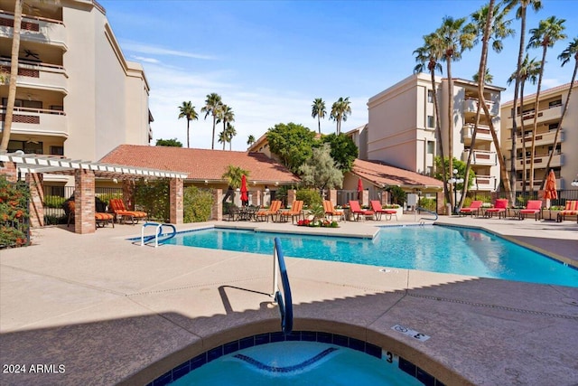 view of swimming pool with a pergola, a hot tub, and a patio area