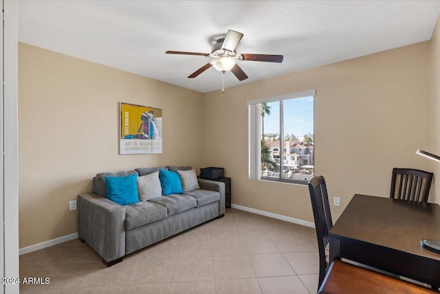 office featuring light tile patterned floors and ceiling fan