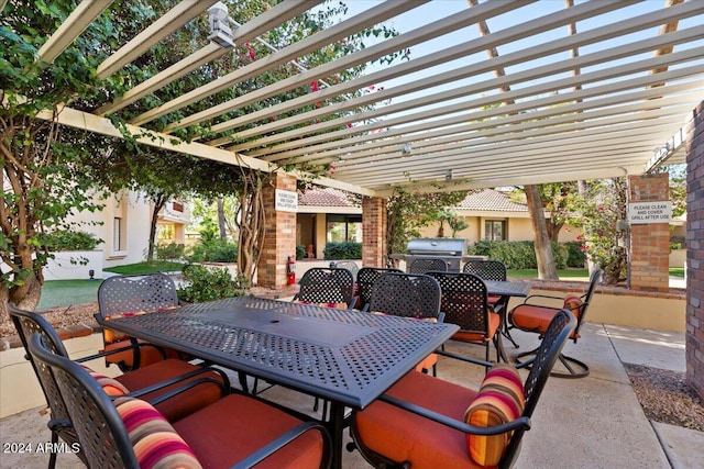 view of patio with a pergola and a grill