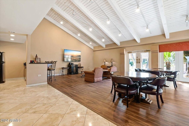 tiled dining room with french doors, high vaulted ceiling, beam ceiling, and wood ceiling