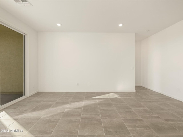 empty room with light tile patterned floors