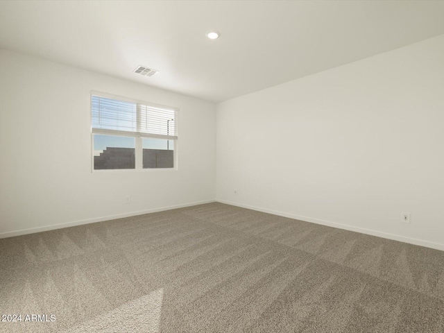 unfurnished room with carpet flooring