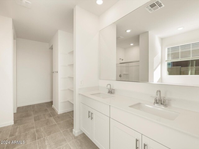 bathroom with vanity and an enclosed shower