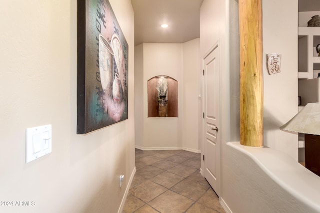 corridor featuring tile patterned floors