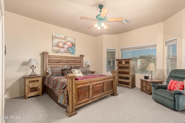 bedroom featuring light carpet and ceiling fan