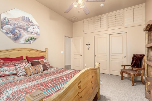 carpeted bedroom with a closet and ceiling fan