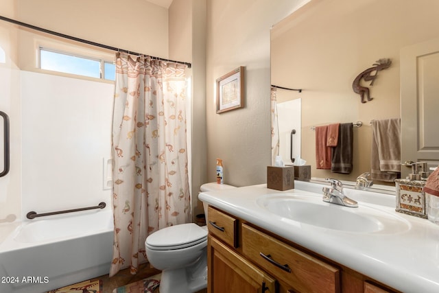 full bathroom with shower / bath combination with curtain, vanity, and toilet